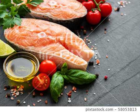 Raw salmon steaks 58053813