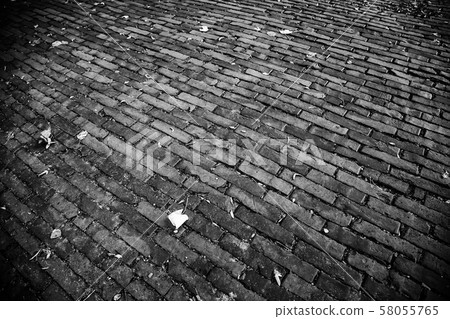 Wet cobbled floor 58055765