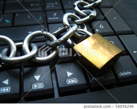 Chain and lock on laptop keyboard. Block chain Chain and lock on laptop keyboard. Block chain 58056296