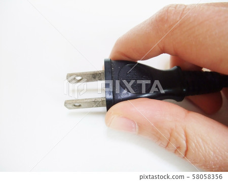 Hand with plug Hand with plug 58058356