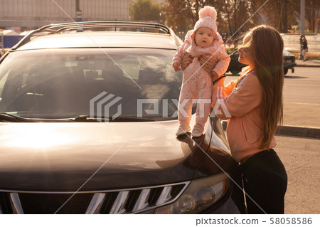 Cute young mother with her little baby girl Cute young mother with her little baby girl 58058586