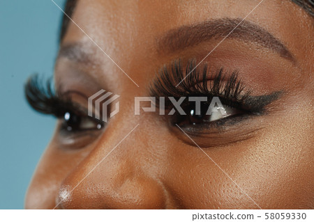 African-american young woman's close up portrait African-american young woman's close up portrait 58059330