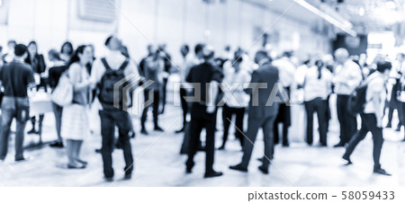 Blured image of businesspeople at coffee break at conference meeting. Blured image of businesspeople at coffee break at conference meeting. 58059433