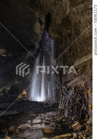 Caver in Gaping Gill Cavern 58061173