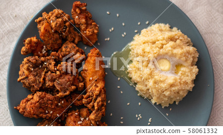crispy chicken with garnish of porridge crispy chicken with garnish of porridge 58061332