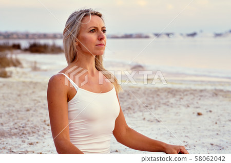 Woman do meditation outdoors Woman do meditation outdoors 58062042
