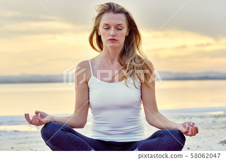 Woman do meditation outdoors Woman do meditation outdoors 58062047