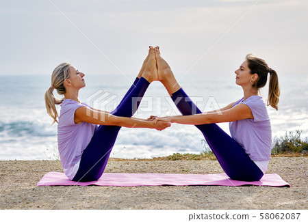 Women doing yoga 58062087