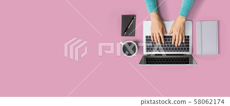 Person using a laptop computer 58062174