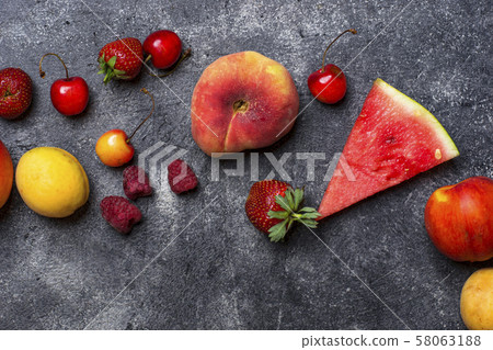Different summer fruits and berries 58063188