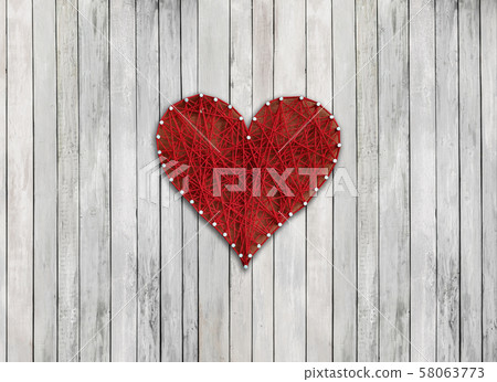 red heart on wooden board red heart on wooden board 58063773
