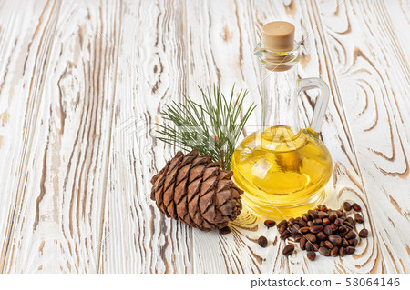 cedar oil in glass bottle 58064146
