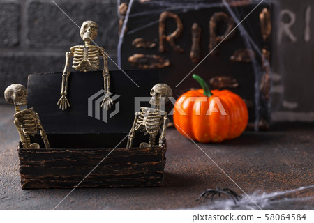 Halloween background with skeletons and tomb Halloween background with skeletons and tomb 58064584