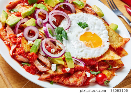 close-up of homemade chilaquiles on a plate close-up of homemade chilaquiles on a plate 58065106
