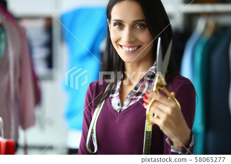 Pretty tailor with scissors Pretty tailor with scissors 58065277