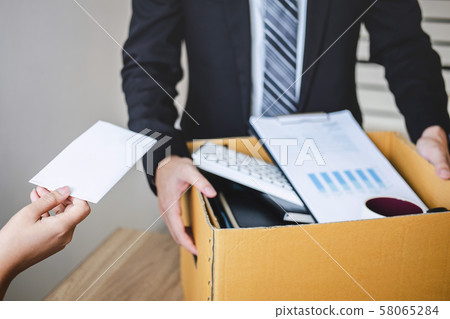 Stressed businessman receive fired letter from 58065284