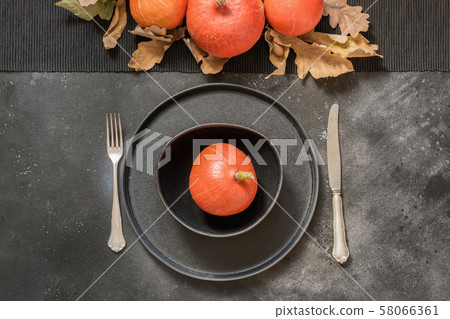Thanksgiving Day or Halloween place setting. 58066361