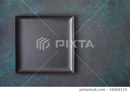 Black square plate on dark Black square plate on dark 58069119