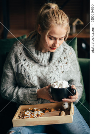 Warming hygge mood. Woman drinking hot chocolate 58069490