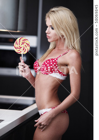 Sexy girl with lollipop - Stock Photo [58069845] - PIXTA