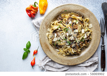 Tagliatelle pasta with mushrooms 58069902