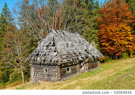 Beautiful wooden house during fall peak season Beautiful wooden house during fall peak season 58069936