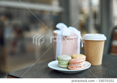 Cookies present and coffee to go on the table stock photo Cookies present and coffee to go on the table stock photo 58070202