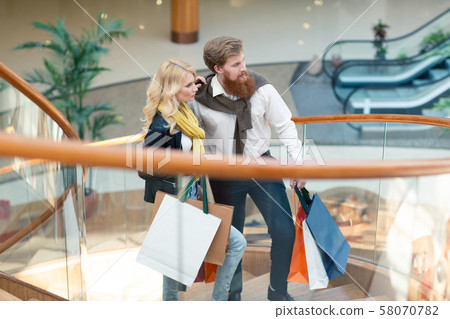 Couple with shopping bags Couple with shopping bags 58070782