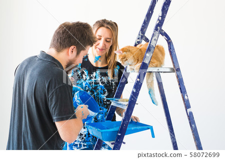 People, renovation, pet and repair concept - Portrait of lovely funny couple with cat doing People, renovation, pet and repair concept - Portrait of lovely funny couple with cat doing 58072699