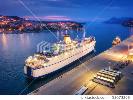 Aerial view of cruise ship at harbor at night 58073206