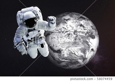 Astronaut close to the frozen Earth Astronaut close to the frozen Earth 58074459