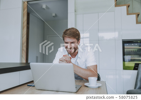 Man waiting for a reply to his message 58075825