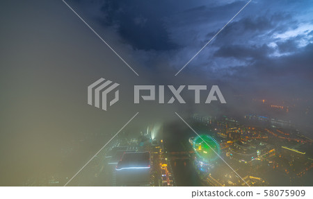 The cityscape of Yokohama, Japan. A thundercloud and blue night sky. Local heavy rains and thunderstorms hit southern Kanto = Yokohama The cityscape of Yokohama, Japan. A thundercloud and blue night sky. Local heavy rains and thunderstorms hit southern Kanto = Yokohama 58075909