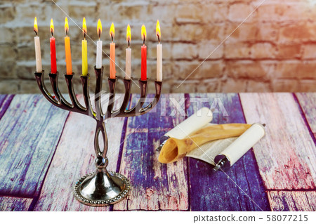 Brightly Glowing Hanukkah Menorah soft focus 58077215