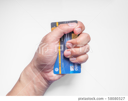 Credit cards in man's hand. 58080327