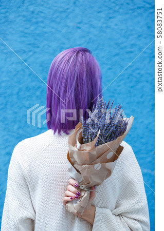 Young lady with lavender bouquet turn her back Young lady with lavender bouquet turn her back 58083751