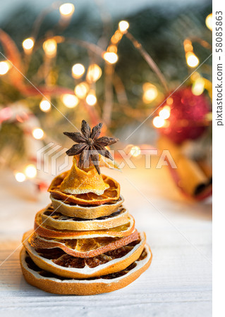 Christmas tree made out of dried orange slices Christmas tree made out of dried orange slices 58085863
