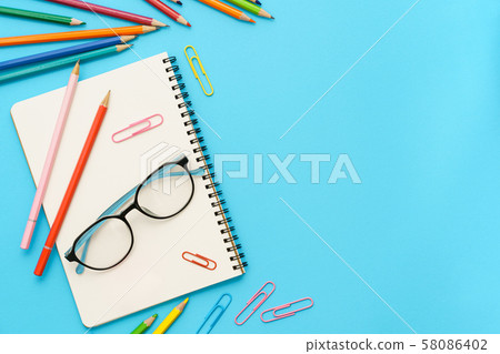 Flat lay photo of office desk with colorful pencil Flat lay photo of office desk with colorful pencil 58086402