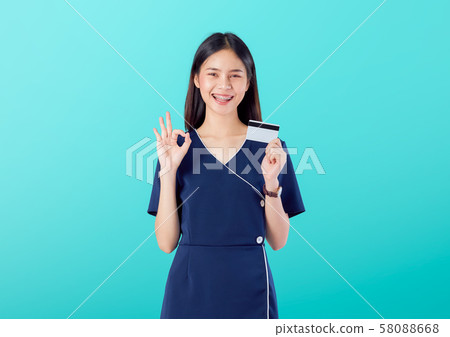 Beautiful Asian woman good skin, shows ok sign Beautiful Asian woman good skin, shows ok sign 58088668