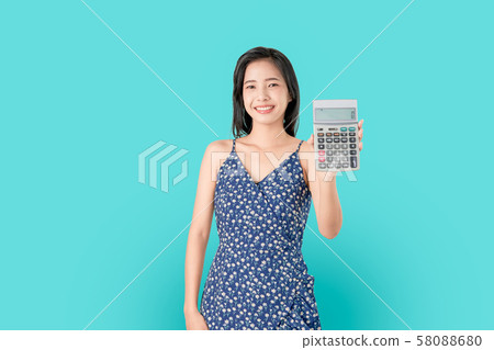Smile Asian woman holding calculator isolated. Smile Asian woman holding calculator isolated. 58088680