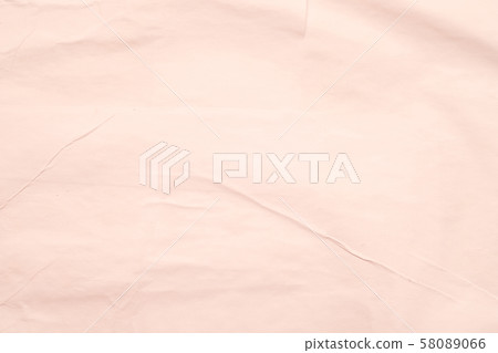 peach color wet paper wrinkled texture background 58089066
