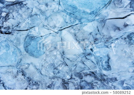 Blue ice texture, winter background, texture of ice surface. Blue ice texture, winter background, texture of ice surface. 58089252