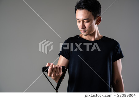 Sportsman doing tube training 58089804