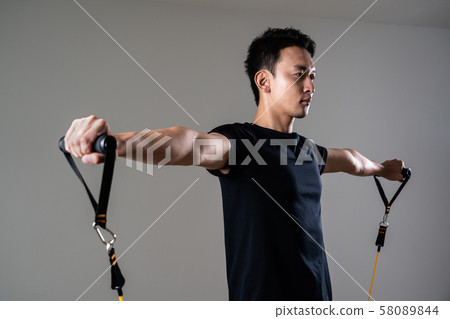 Sportsman doing tube training 58089844