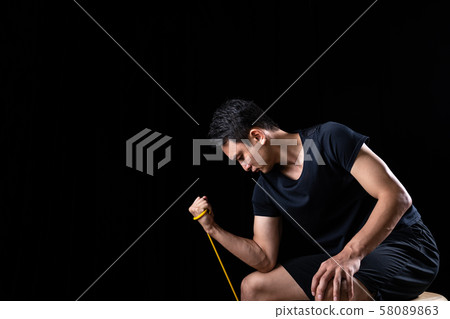 Sportsman doing tube training 58089863