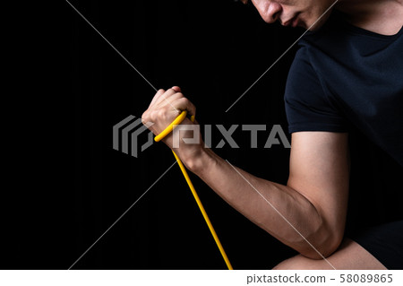 Sportsman doing tube training 58089865