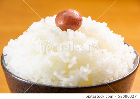 One pickled plum on top of mountain rice. One pickled plum on top of mountain rice. 58090327