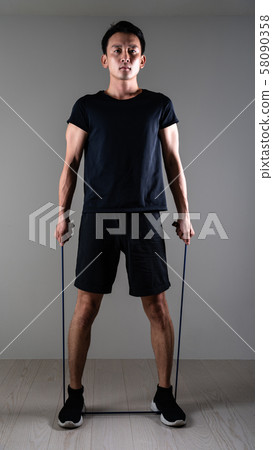 Sportsman doing tube training 58090358