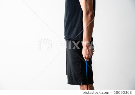 Sportsman doing tube training 58090368