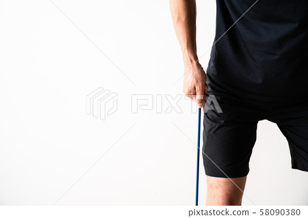 Sportsman doing tube training 58090380